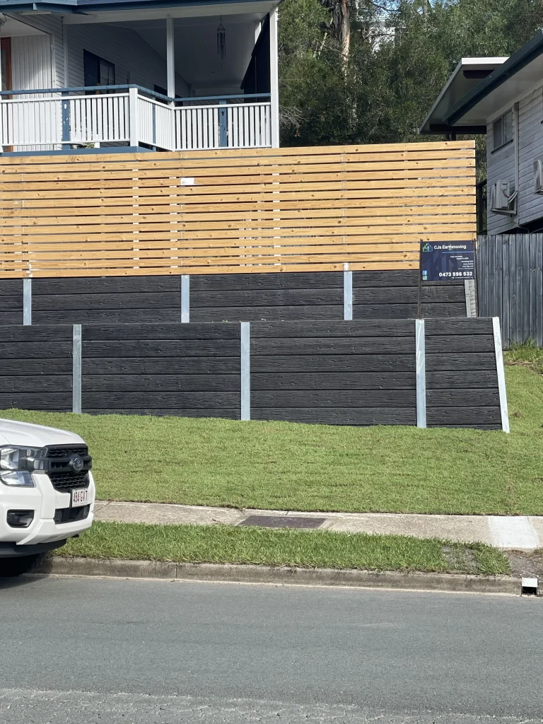 Excavator preparing retaining wall footings at Ferny Hills